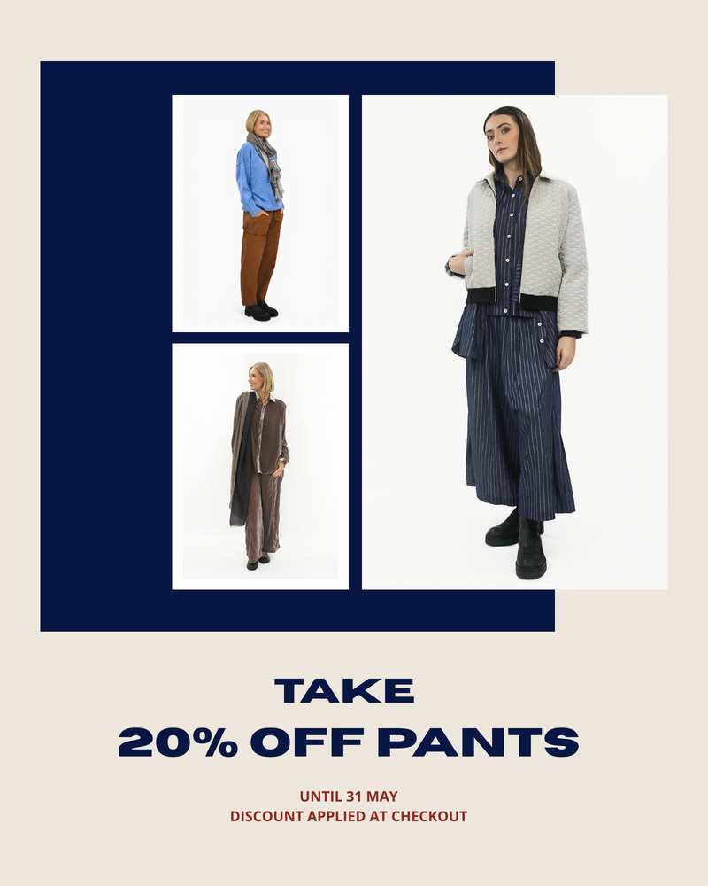 Promotional advertisement for clothing with models wearing winter outfits and a discount offer on pants.