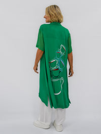 Green  short sleeve dress with tea cups and tea pot cascading down the back 